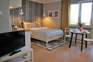A bed or beds in a room at Apartament Studio 208