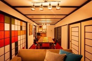 a living room with a couch and a table at Taisho Modern Villa Zen in Hakone