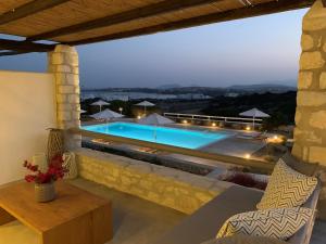 a villa with a swimming pool at night at Sand Key Villa 2 in Santa Maria