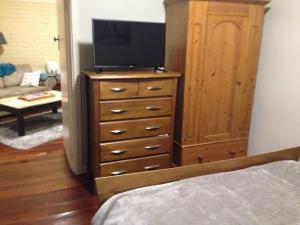A television and/or entertainment center at Affordable & comfortable Apartment on Langley Park