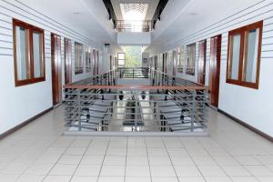 a hallway of a building with a rack of wine bottles at N Hotel Harmoni Jakarta in Jakarta