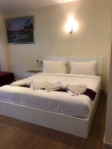 Postel nebo postele na pokoji v ubytování DB Residence