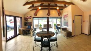 a dining room with a table and chairs in a room at APM Inn and Suites in Winchester