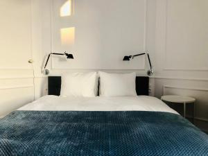 Posteľ alebo postele v izbe v ubytovaní St. Florian Apartament