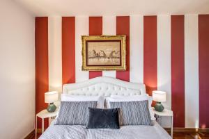 Posteľ alebo postele v izbe v ubytovaní AwesHomeItaly - Lungarno Bellavista Penthouse