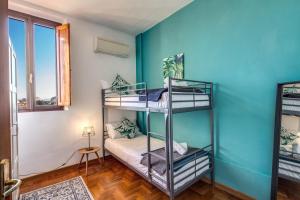Posteľ alebo postele v izbe v ubytovaní AwesHomeItaly - Lungarno Bellavista Penthouse
