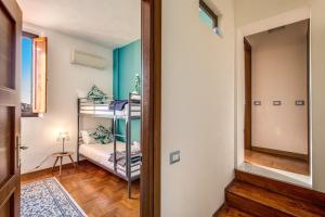 Posteľ alebo postele v izbe v ubytovaní AwesHomeItaly - Lungarno Bellavista Penthouse