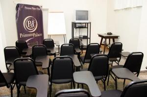 a room with rows of chairs and a board at Primum Palace Hotel in Dracena +71 photos