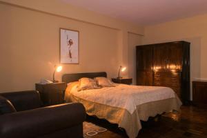 Un pat sau paturi într-o cameră la La Maison Martinet