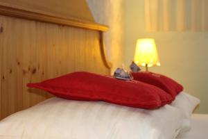 A bed or beds in a room at Gasthof Burkert