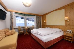 A bed or beds in a room at Gasthof Burkert