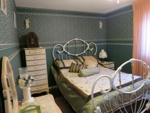 Łóżko lub łóżka w pokoju w obiekcie All Seasons Bed & Breakfast