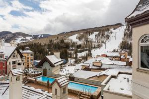a view of a resort with a snow covered mountain at Pop Art Villa Vail in Vail