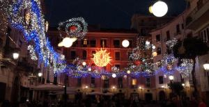 a city street with christmas lights and a building at Locanda della Bottega in Fisciano