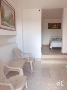 Ένα ή περισσότερα κρεβάτια σε δωμάτιο στο Apartahotel El Horizonte