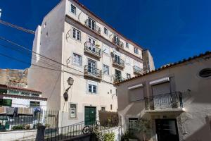 a tall building with balconies on the side of it at Alfama Historical Apartment in Lisbon
