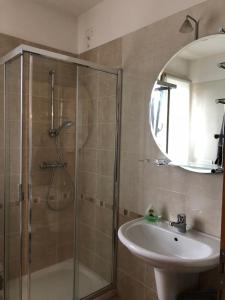 a bathroom with a shower and a sink at La stanza di Cesare in Treviso