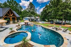 a group of people swimming in a swimming pool at The Estate in Eatonton 