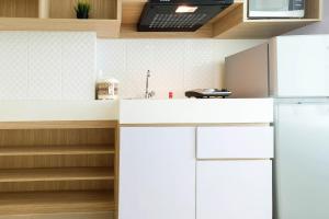 Η κουζίνα ή μικρή κουζίνα στο Cozy Studio Tree Park Apt