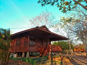 a small wooden house on the side of a road at Nirwana Buton Villa in Baubau