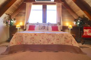 a bedroom with a large bed with a large window at Silverpoint Estate in Pokolbin +43 photos