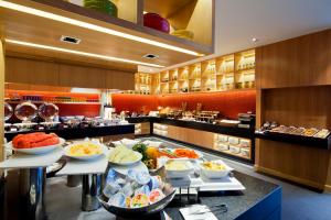 a buffet line with bowls of food in a restaurant at Amari Hua Hin in Hua Hin +287 photos