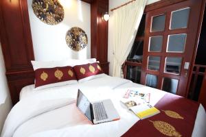 Postel nebo postele na pokoji v ubytování Manorom Boutique Hotel