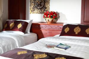 Postel nebo postele na pokoji v ubytování Manorom Boutique Hotel