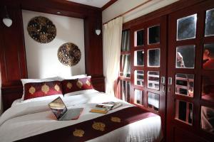 Postel nebo postele na pokoji v ubytování Manorom Boutique Hotel + 23 fotografií