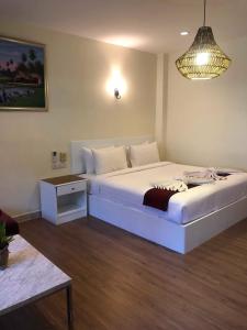 Postel nebo postele na pokoji v ubytování DB Residence