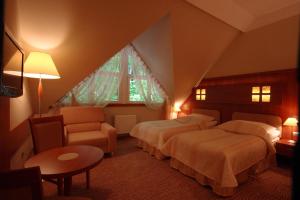 Postel nebo postele na pokoji v ubytování Hotel Sahara