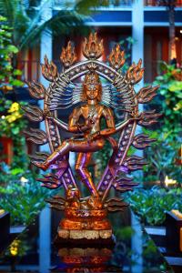 a statue of a woman sitting on top at Mercure Kuta Bali in Kuta