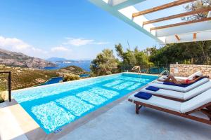 a villa with a pool and a view at Villa Luxe in Sivota