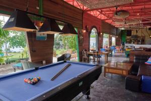 a pool table in the middle of a room at Elephant Bay Resort in Ko Chang