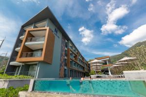 Bazén v ubytování The Nature Phuket - SHA Extra Plus nebo v jeho okolí