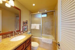 a bathroom with a sink and a shower and a toilet at Nani Kai Hale in Kihei
