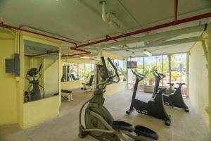 a gym with treadmills and ellipticals in a room at Sunrise Suites Bonaire Suite #210 in Key West
