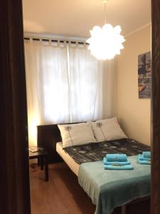 Posteľ alebo postele v izbe v ubytovaní Apartament Centrum Park