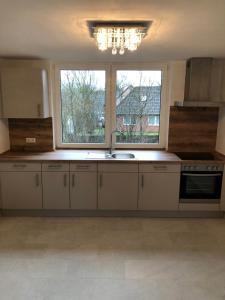Kuchyň nebo kuchyňský kout v ubytování Lux Apartmant Westerstede