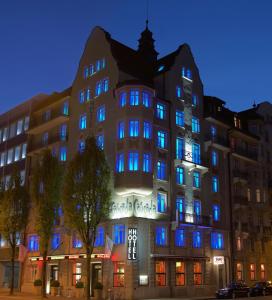 a large building with blue lights on it at Cascada Boutique Hotel in Lucerne