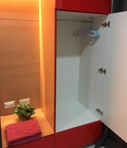 a bathroom with a mirror and a plant on a counter at Cityscape Residences 1102 in Bacolod