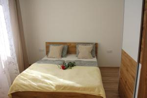 A bed or beds in a room at Apartmánový dom Mária
