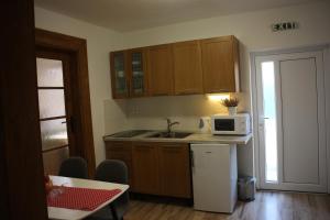 A kitchen or kitchenette at Apartmánový dom Mária