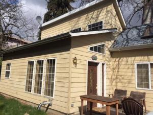 a small house with a bench in front of it at Waveseeker in White Salmon