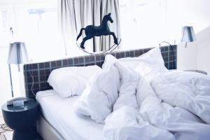 Postelja oz. postelje v sobi nastanitve Hotel Rössli