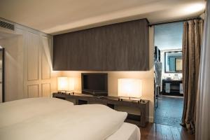 Postel nebo postele na pokoji v ubytování CoolRooms Palacio Villapanés 5 GL