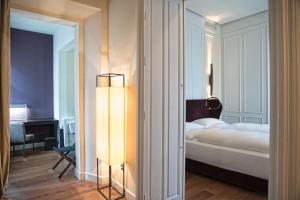 Postel nebo postele na pokoji v ubytování CoolRooms Palacio Villapanés 5 GL