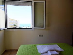 Posteľ alebo postele v izbe v ubytovaní Platanias House on the Beach