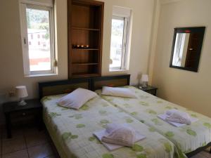 Posteľ alebo postele v izbe v ubytovaní Platanias House on the Beach
