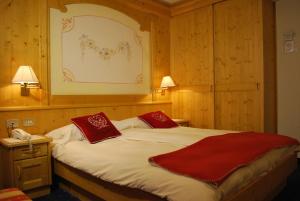 Postel nebo postele na pokoji v ubytování Piccolo Hotel